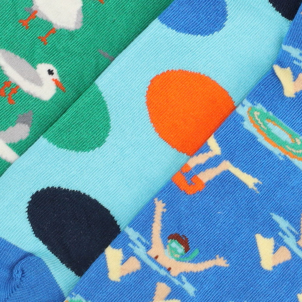 Discover three pairs of vibrant cotton socks that instantly brighten up your daily wardrobe. Crafted from 100% pure cotton, they deliver a soft, breathable fit ideal for all-day comfort. The durable, high-quality prints retain their brilliance even after many washes. These unisex socks are designed to stay in place without squeezing, making them a perfect fusion of style and functionality.